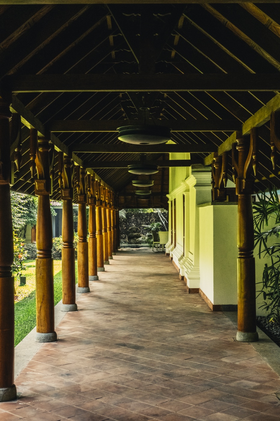 The long covered walkway with timber pillars that links the pavilions
