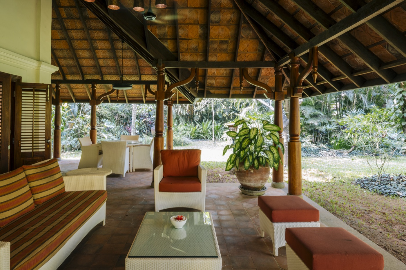 An open-sided pavilion lounge facing the garden